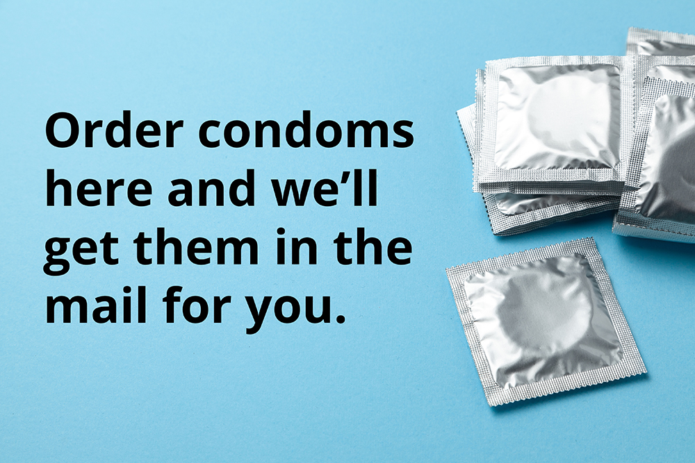 Condoms in pack on blue background. Copy space for text