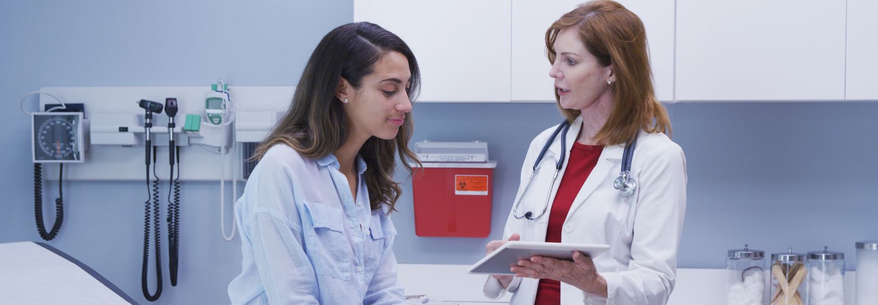 young woman talking to a doctor
